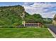 Scenic Ken-Caryl Ranch entrance sign with lush landscaping against a beautiful mountain backdrop at 10866 W Half Moon Pass, Littleton, CO 80127