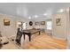 Spacious game room with pool table, wood floors, and ample lighting at 10866 W Half Moon Pass, Littleton, CO 80127