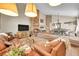 Spacious living room area with fireplace and ample seating at 10866 W Half Moon Pass, Littleton, CO 80127