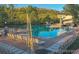 Community pool with water slides and ample seating in a picturesque setting at 10866 W Half Moon Pass, Littleton, CO 80127
