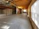 Spacious unfinished basement with concrete flooring, exposed ceiling and support beams, and a window at 24955 E Roxbury Pl, Aurora, CO 80016