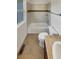 Bathroom featuring vanity, toilet, and bathtub with tile surround at 24955 E Roxbury Pl, Aurora, CO 80016
