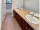 Bathroom with a double sink vanity, tile floor, and a view of the shower and tub at 24955 E Roxbury Pl, Aurora, CO 80016