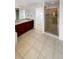 Bathroom featuring vanity with drawers and glass-enclosed shower at 24955 E Roxbury Pl, Aurora, CO 80016