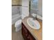 Bright bathroom featuring vanity, toilet, and bathtub with tile surround at 24955 E Roxbury Pl, Aurora, CO 80016