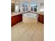 Bright bathroom featuring double vanity, large tub, and tile flooring at 24955 E Roxbury Pl, Aurora, CO 80016