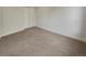 Neutral bedroom featuring carpeted floors and large closet at 24955 E Roxbury Pl, Aurora, CO 80016