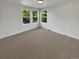 Bright bedroom features multiple windows and neutral carpet at 24955 E Roxbury Pl, Aurora, CO 80016
