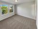 Bright bedroom featuring large windows and built-in shelving at 24955 E Roxbury Pl, Aurora, CO 80016