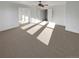 Bedroom with neutral carpet, ceiling fan and multiple closets at 24955 E Roxbury Pl, Aurora, CO 80016