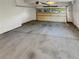 Clean garage featuring a neutral concrete floor, white walls, and an automatic door at 24955 E Roxbury Pl, Aurora, CO 80016