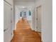 Bright entryway featuring hardwood floors, white walls, and an open view into the living spaces at 24955 E Roxbury Pl, Aurora, CO 80016