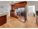 Modern kitchen with stainless steel refrigerator and built-in oven and microwave at 24955 E Roxbury Pl, Aurora, CO 80016