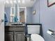 Cozy bathroom with marble sink, storage cabinet, and modern fixtures at 7160 W Stetson Pl # 27, Littleton, CO 80123