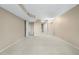 A neutral bedroom featuring a light carpet, a ceiling with recessed lights, and entryways to the bathroom and closet at 7160 W Stetson Pl # 27, Littleton, CO 80123