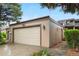 Attached one car garage with neutral paint and a well maintained driveway at 7160 W Stetson Pl # 27, Littleton, CO 80123