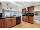 Modern kitchen featuring wooden cabinets, granite countertops, and stainless steel appliances at 7160 W Stetson Pl # 27, Littleton, CO 80123