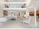 Bright living room featuring two story ceiling, stairs to the loft, and view to the kitchen at 7160 W Stetson Pl # 27, Littleton, CO 80123