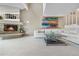 Spacious living room with a fireplace, modern artwork, and a large sectional sofa at 7160 W Stetson Pl # 27, Littleton, CO 80123