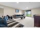 Spacious living room with sliding glass door to yard and comfortable seating at 7160 W Stetson Pl # 27, Littleton, CO 80123