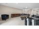 A large living room area with comfortable furniture and a staircase to the upper level at 7160 W Stetson Pl # 27, Littleton, CO 80123