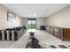 Living room with comfortable seating and glass door to back yard with fence at 7160 W Stetson Pl # 27, Littleton, CO 80123