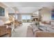 Bright living room featuring a fireplace, neutral carpeting, and large sliding glass doors to the exterior at 7160 W Stetson Pl # 27, Littleton, CO 80123