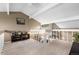 Cozy loft area featuring neutral carpet, white railing, vaulted ceilings, and an entertainment center at 7160 W Stetson Pl # 27, Littleton, CO 80123