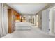 Cozy main bedroom with built-in cabinets, bright mirrors, and private bathroom access at 7160 W Stetson Pl # 27, Littleton, CO 80123