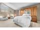 Spacious main bedroom features a large bed, built-in storage, and relaxing sitting area at 7160 W Stetson Pl # 27, Littleton, CO 80123