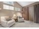 Bright sitting area with cozy chairs, soft lighting, and a view from the windows at 7160 W Stetson Pl # 27, Littleton, CO 80123