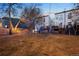 Spacious backyard with stairs to deck, and grassy lawn at 1581 N Ogden St, Denver, CO 80218