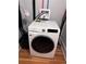 Laundry closet with a modern Samsung washing machine at 1581 N Ogden St, Denver, CO 80218