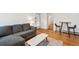 Cozy living room with a gray couch, coffee table and a view to other areas at 1581 N Ogden St, Denver, CO 80218