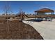 Community playground with a covered picnic area and bike racks at 5459 Westin Hills Dr, Elizabeth, CO 80107