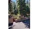 Multi-tiered garden beds constructed of brick sit in a backyard at 34498 Forest Estates Rd, Evergreen, CO 80439