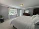 Cozy bedroom with large window providing an abundance of natural light at 34498 Forest Estates Rd, Evergreen, CO 80439