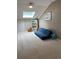 Bright bedroom with a skylight, blue sofa, and charming decorations for  at 34498 Forest Estates Rd, Evergreen, CO 80439