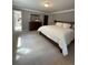 Spacious bedroom with large bed, ensuite bath, dresser, and backyard view at 34498 Forest Estates Rd, Evergreen, CO 80439