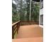 Large wooden deck perfect for relaxation and outdoor activities, surrounded by a lush forest at 34498 Forest Estates Rd, Evergreen, CO 80439