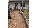 Charming front entrance adorned with festive Halloween decorations and autumn foliage, creating a welcoming curb appeal at 34498 Forest Estates Rd, Evergreen, CO 80439