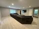 Comfortable living room featuring recessed lighting, a window, a large sectional and a television for entertainment at 34498 Forest Estates Rd, Evergreen, CO 80439
