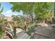 Landscaped backyard with charming wooden bridge at 7513 Simms Ct, Arvada, CO 80005