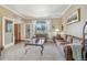 Cozy living room with natural light and tan colored furniture and decor at 7513 Simms Ct, Arvada, CO 80005