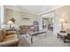 Relaxing living room with carpeting, neutral colors, and lots of furniture at 7513 Simms Ct, Arvada, CO 80005