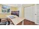 Office space featuring hardwood floors, two monitors, a window, and plenty of natural light at 7513 Simms Ct, Arvada, CO 80005