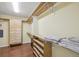 Spacious walk-in closet with wood shelves, drawers, hanging space, and wood floors at 7513 Simms Ct, Arvada, CO 80005