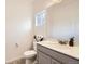 Powder bathroom with a modern vanity, lighting and toilet at 14700 E 104Th Ave # 1404, Commerce City, CO 80022
