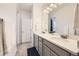 Bathroom with double sinks, gray cabinets, and modern finishes at 14700 E 104Th Ave # 1404, Commerce City, CO 80022