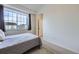Bedroom featuring carpet, a window, and bed at 14700 E 104Th Ave # 1404, Commerce City, CO 80022